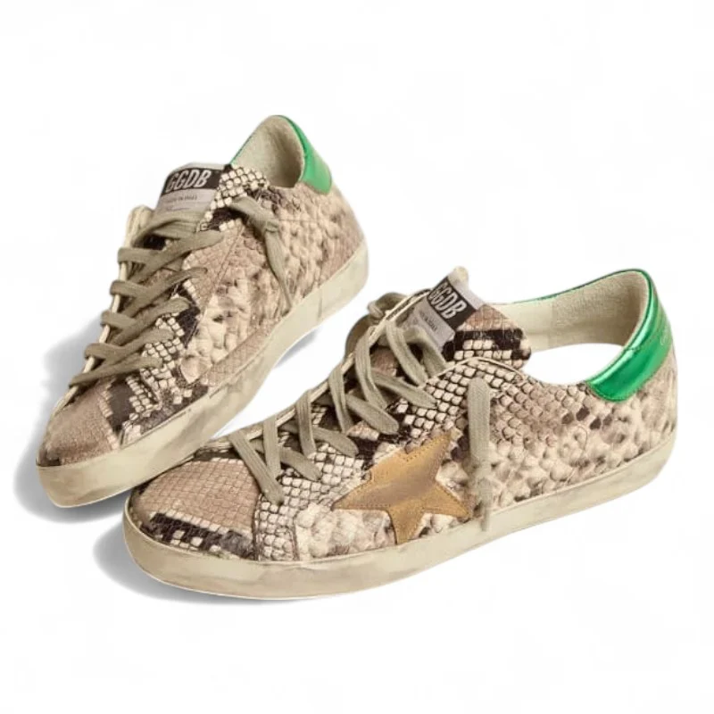 The Super-Star LTD sneakers feature a snake-print leather upper paired with a green laminated leather heel tab
