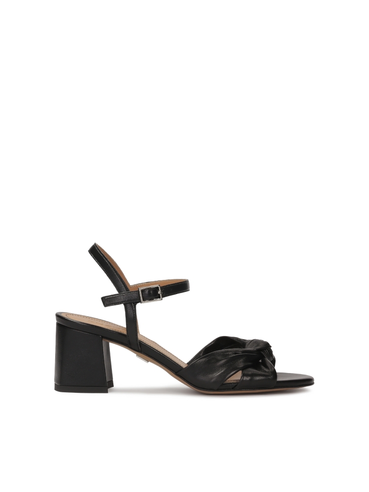 Black leather sandals with a decorative knot