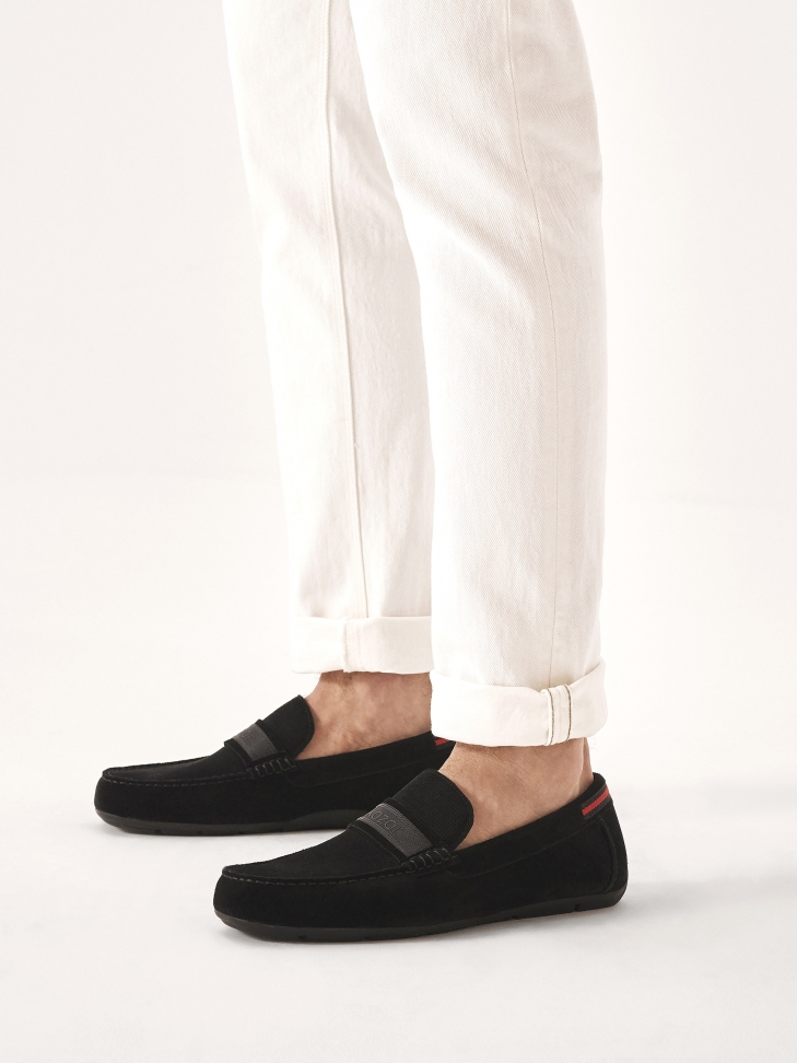 Black suede moccasins embellished with logo ribbon