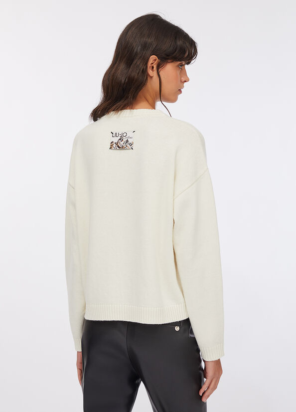 Maglia con scritta ricamata