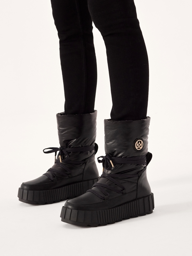 Insulated black snow boots with slip-on upper