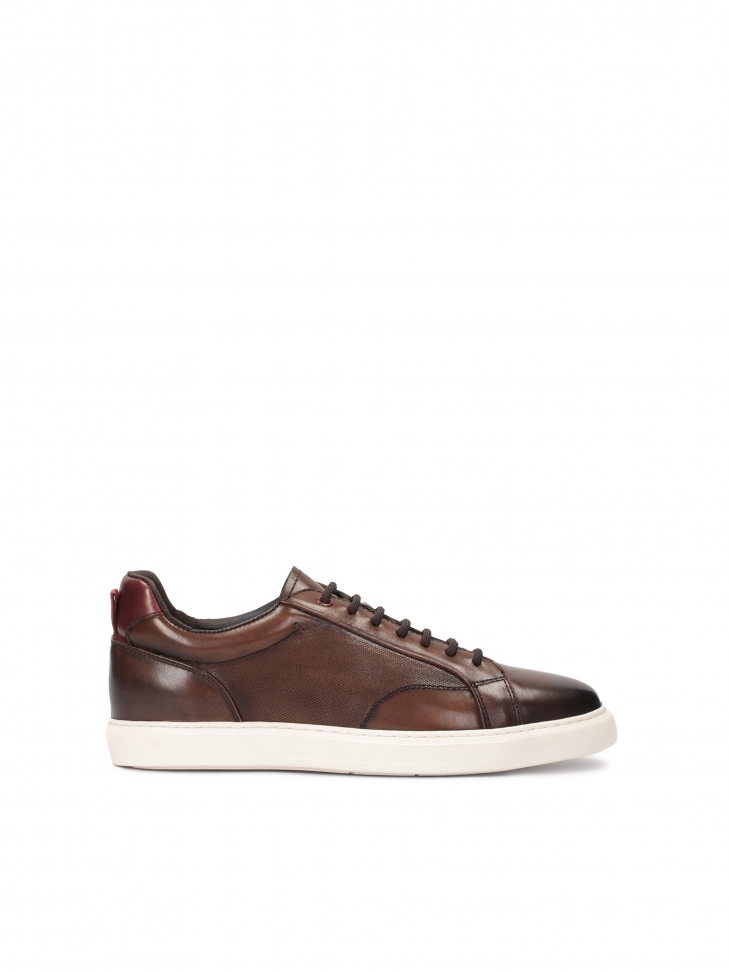 Brown leather sneakers on a white sole
