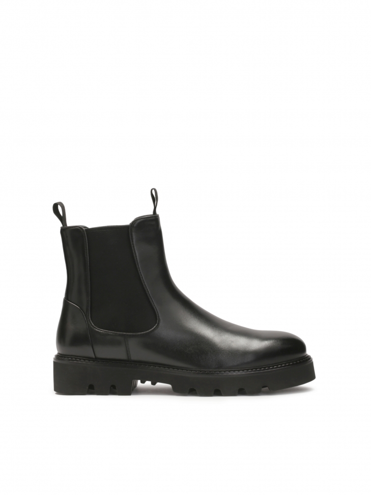 Classic black men's Chelsea boots on a trefoil sole