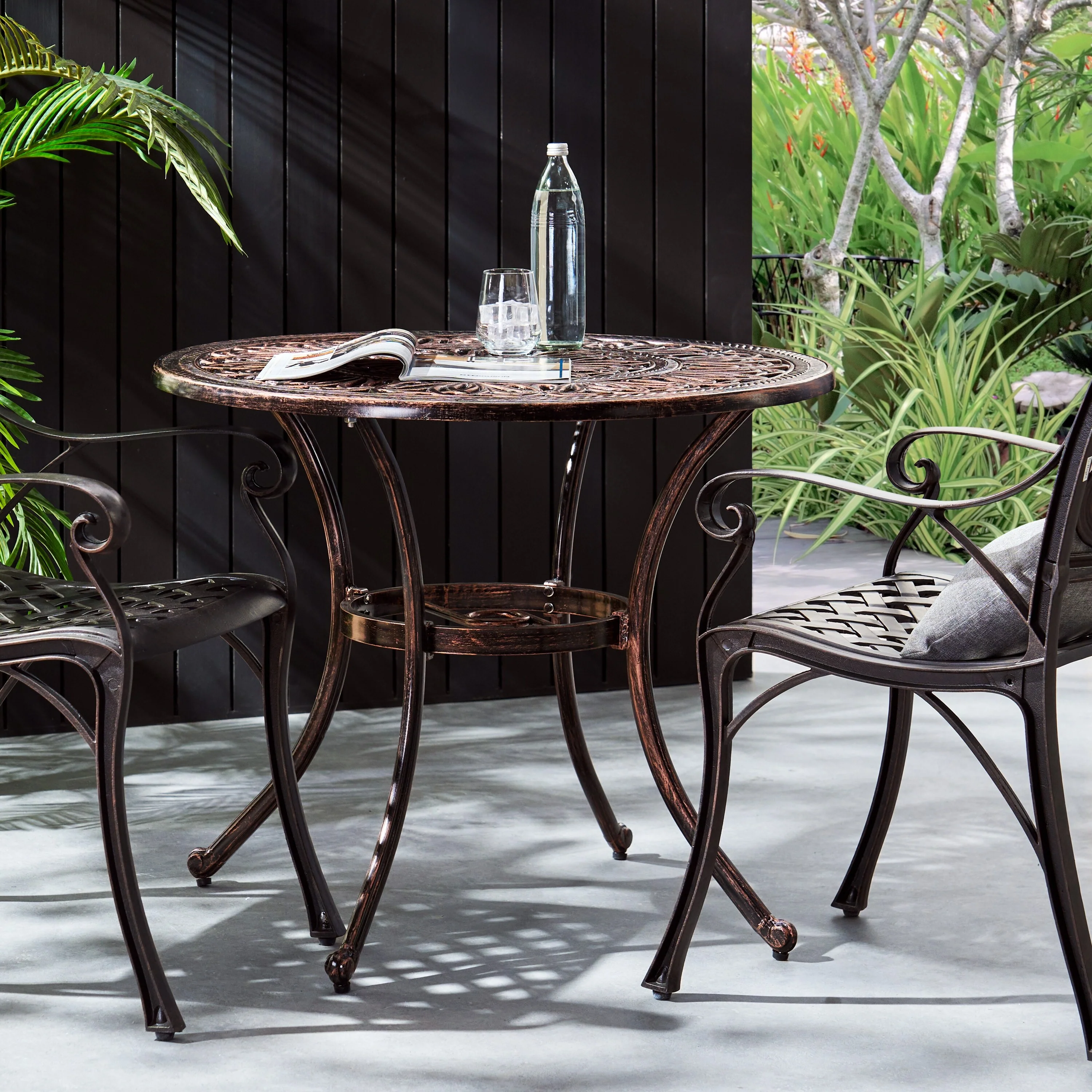Roomfitters Outdoor Round Cast Aluminum Dining Table in Shiny Copper, Elegant Design with Intricate Patterns