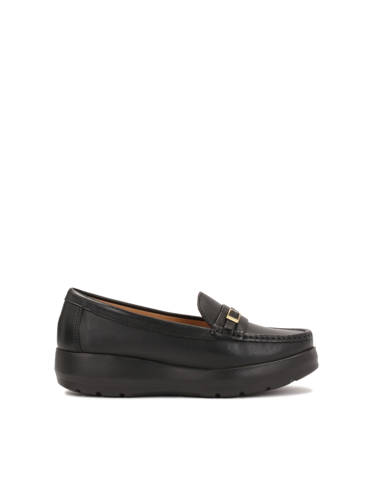 Black loafers on a raised sole
