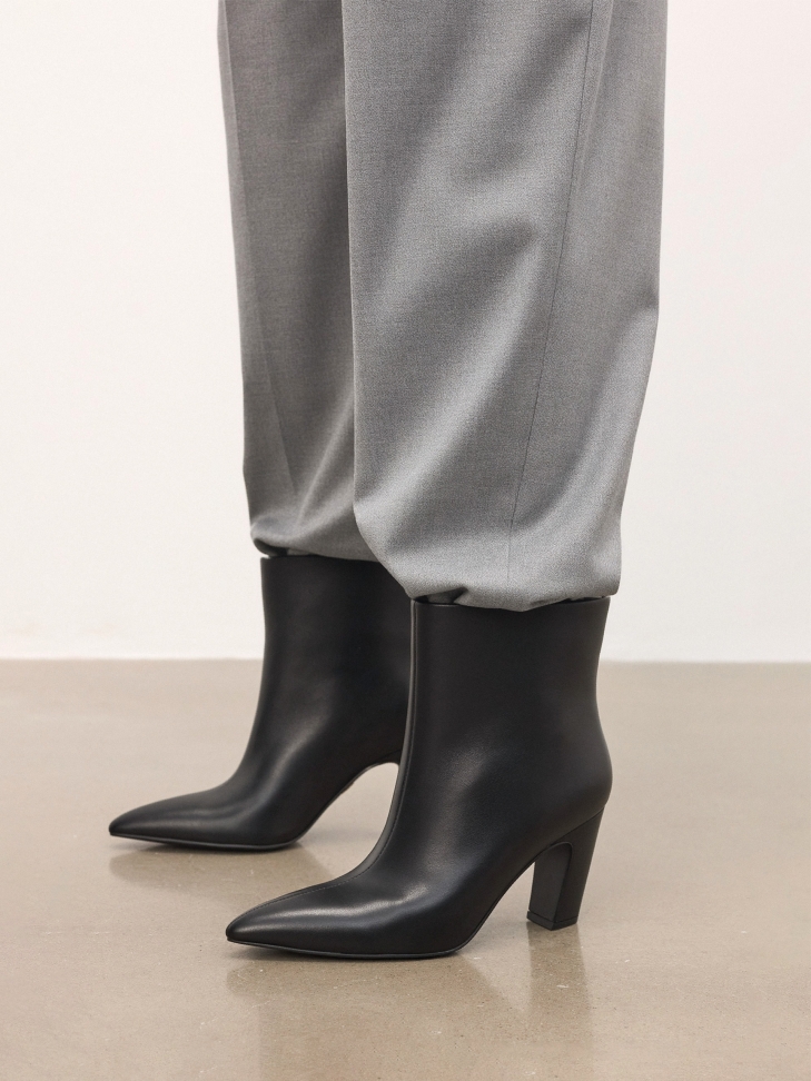 Black heeled boots with slip-on upper