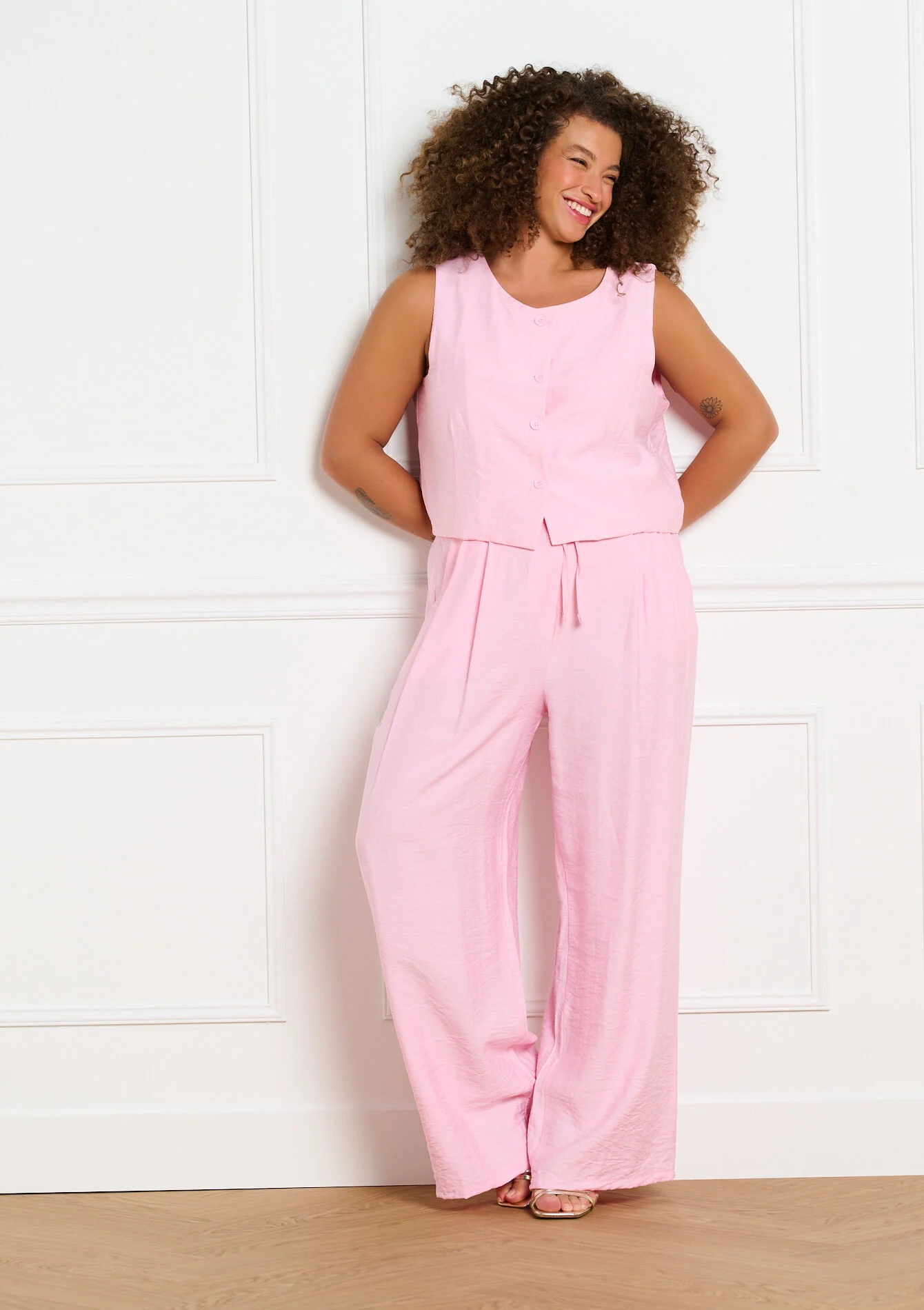 Mouwloos gilet met knopen