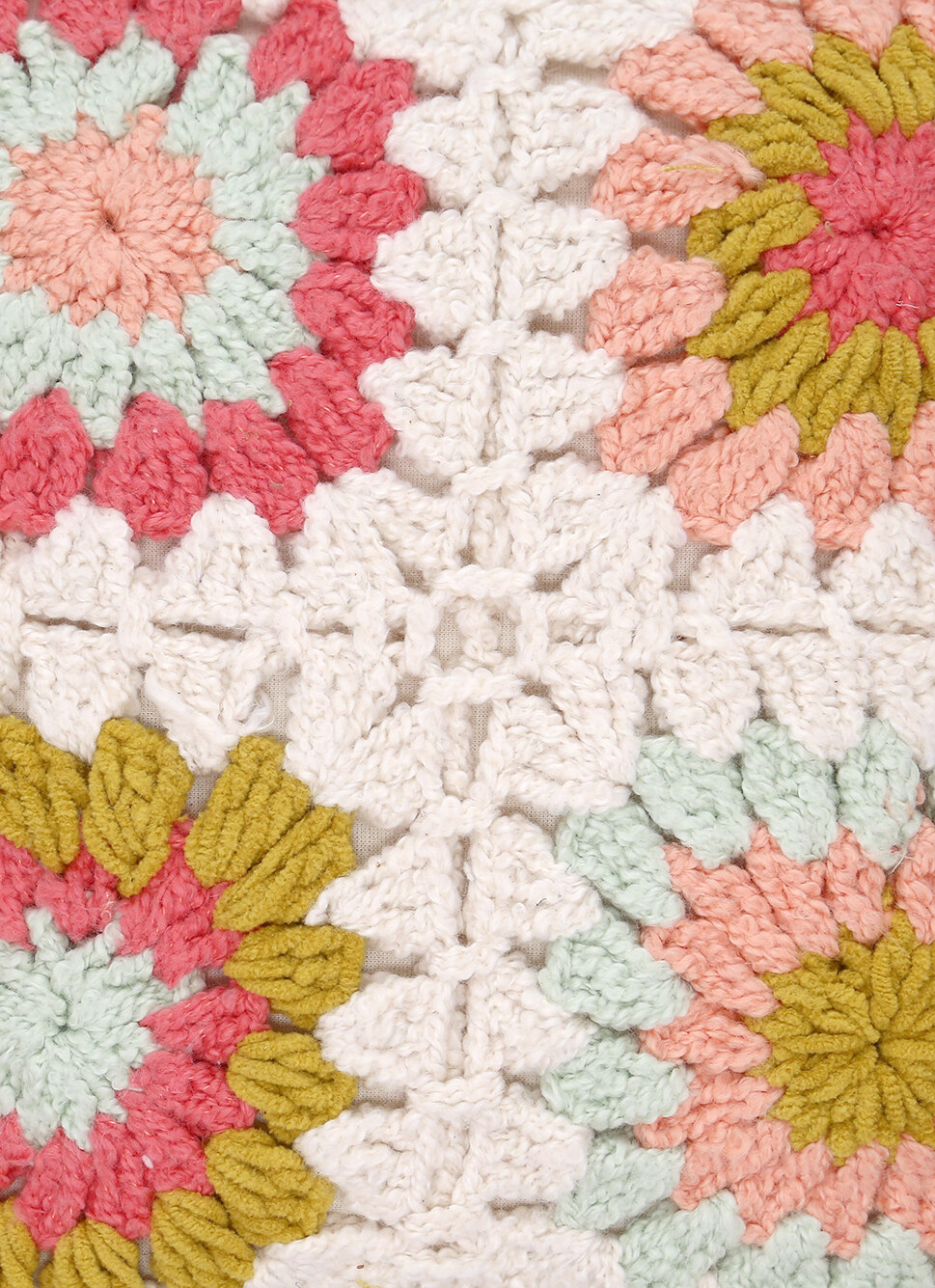 COUSSIN EN TRICOT EN FORME DE FLEUR MULTICOLORE