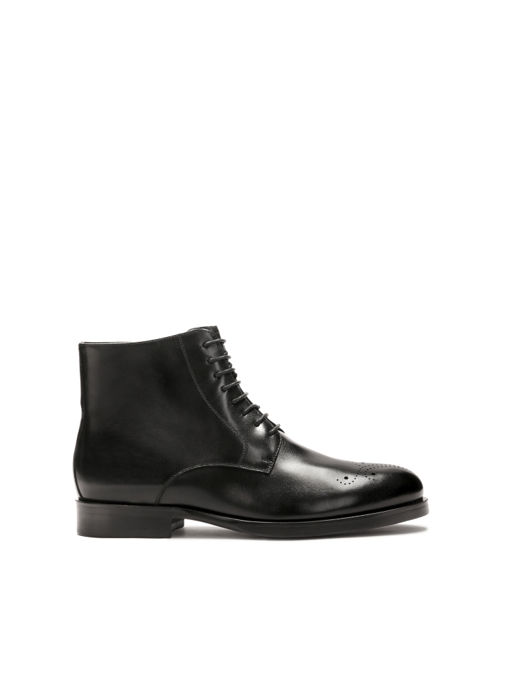 Black smooth leather boots with openwork embellishment