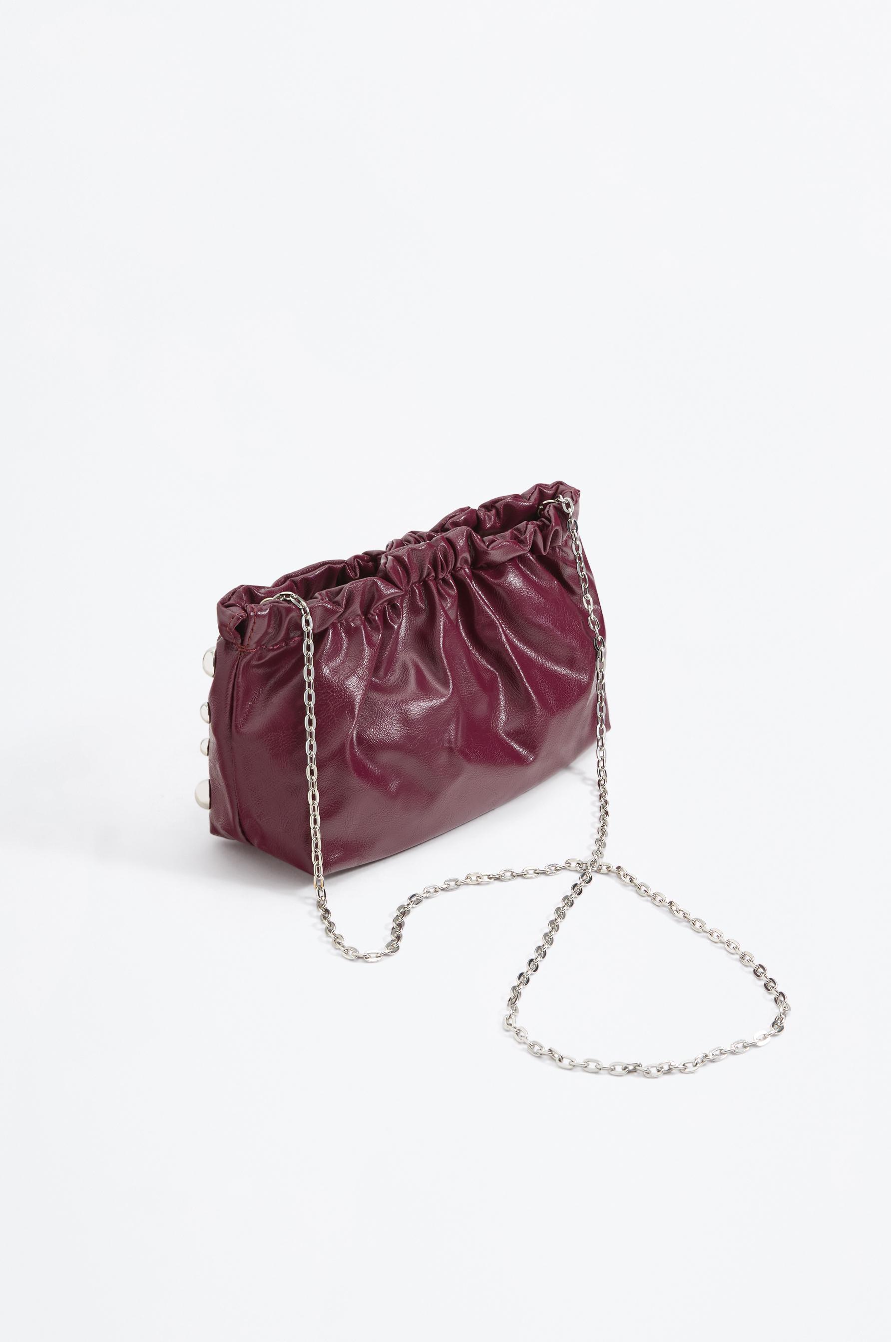 Bolso Pouch tachas