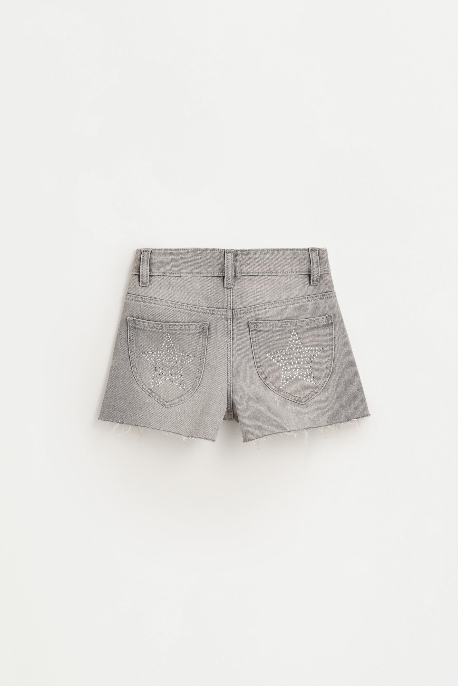 Short denim tachas