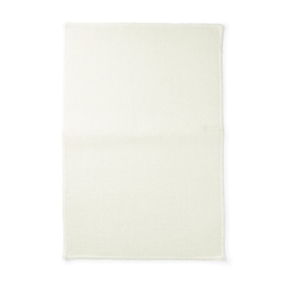 Tapis salle de bain 57x38cm polypropylène et latex blanc