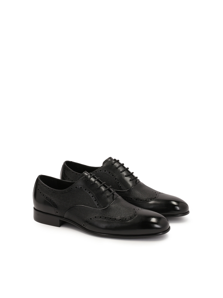 Elegant black oxfords with rosette decoration