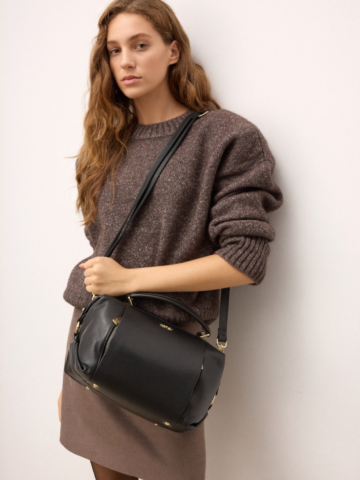 Black leather trunk handbag and gold details