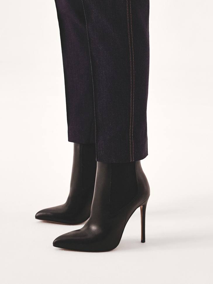 Black slip-on boots with slim heel