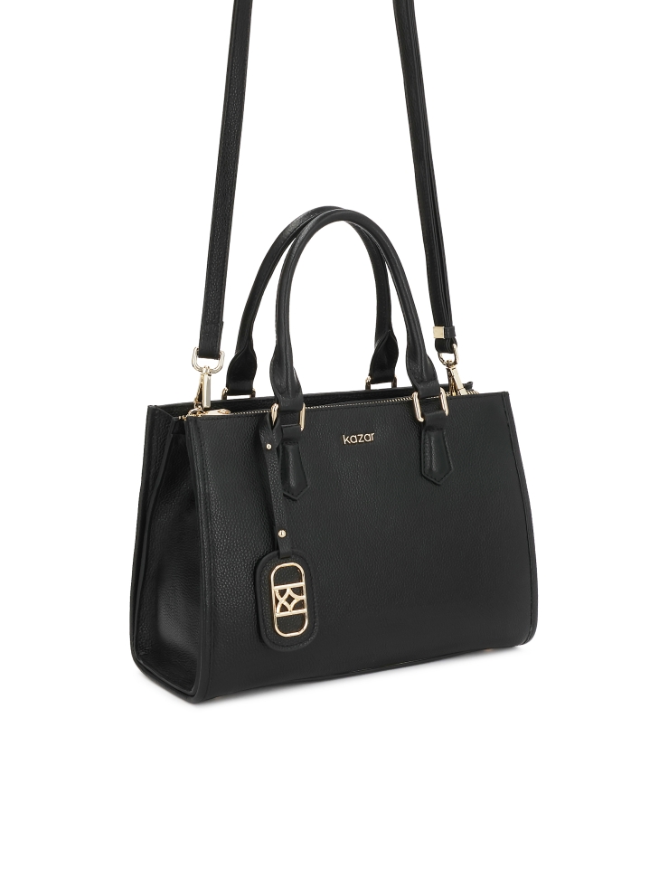 Black leather handbag with detachable strap and lockable compartment