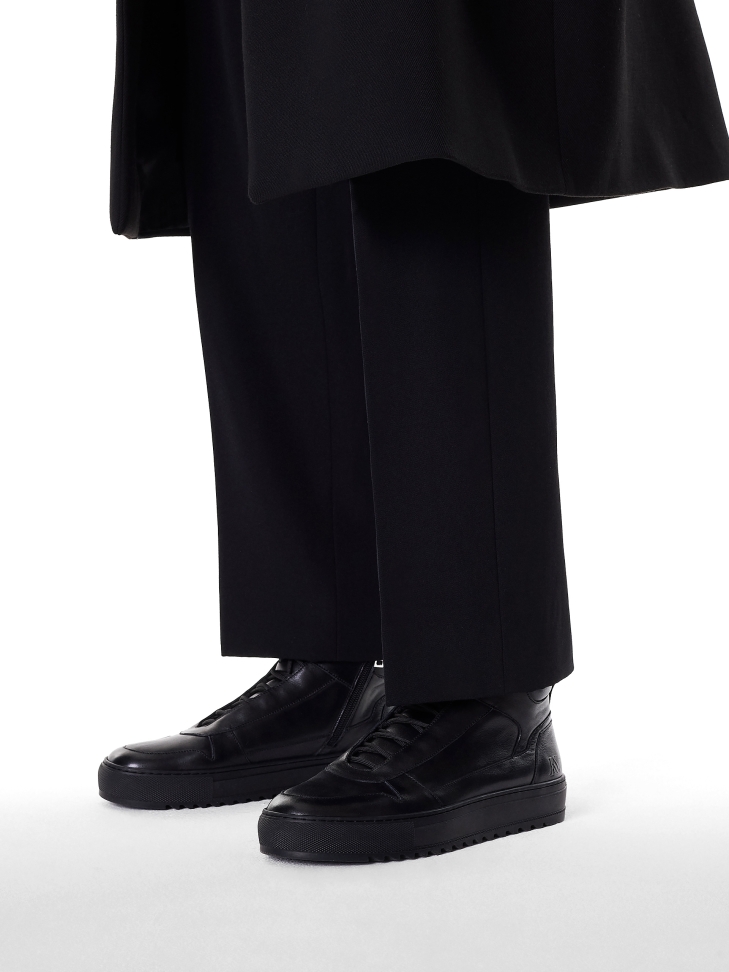 Black sneakers with high upper and lacing