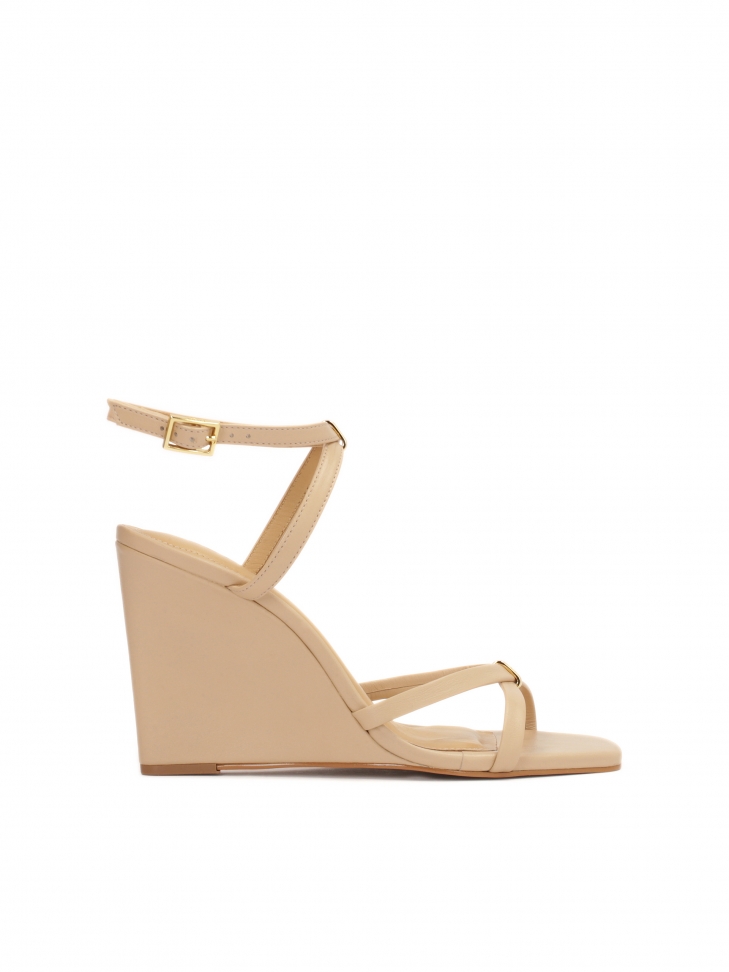 Beige leather sandals on a platform heel