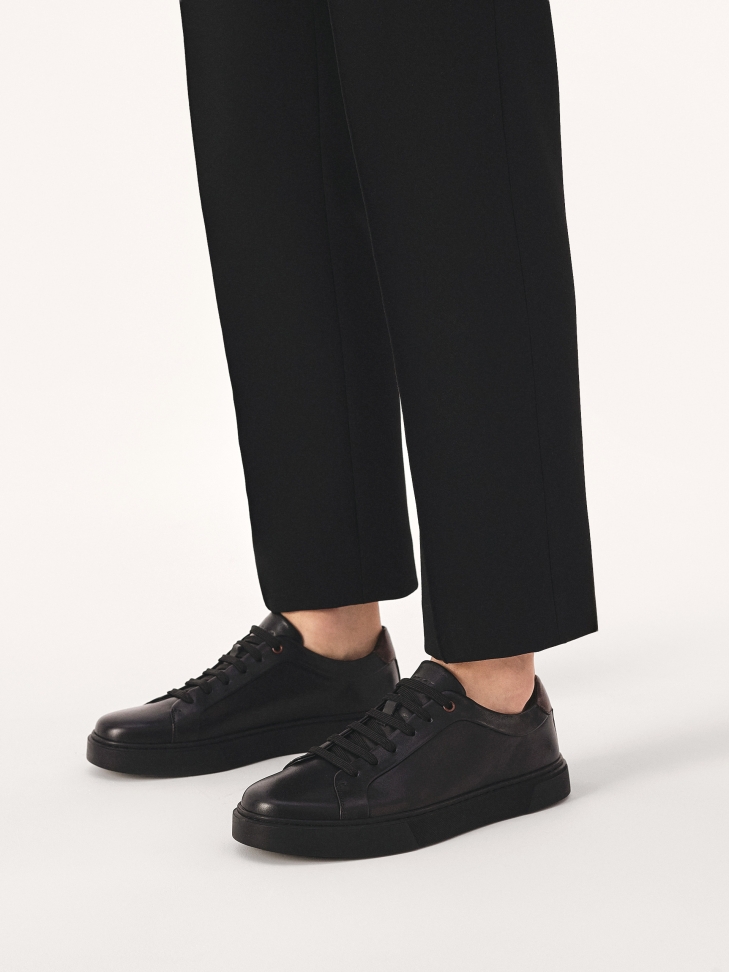 Black sneakers with brown insert
