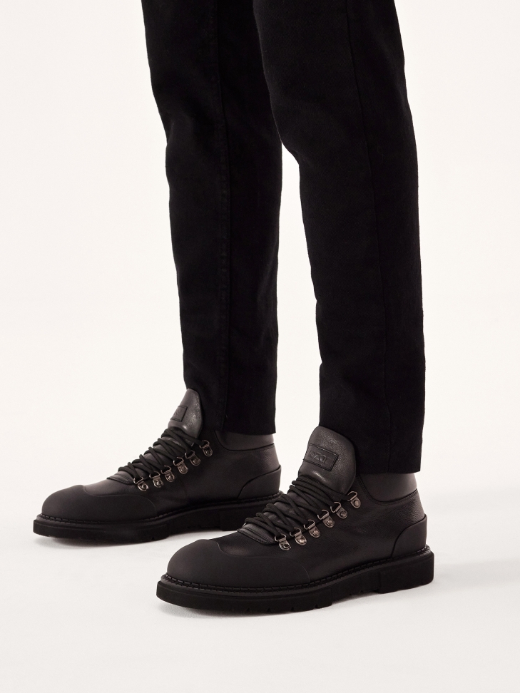 Lace-up boots with rubber toes