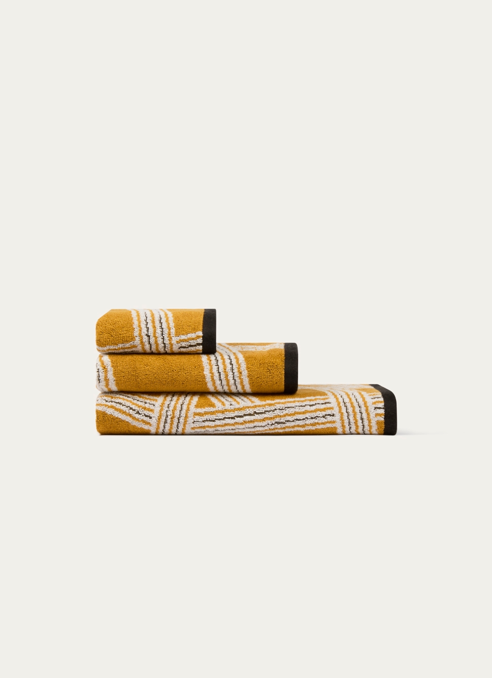 SERVIETTE DE TOILETTE JACQUARD MOTIFS GÉOMÉTRIQUES JAUNE OCRE
