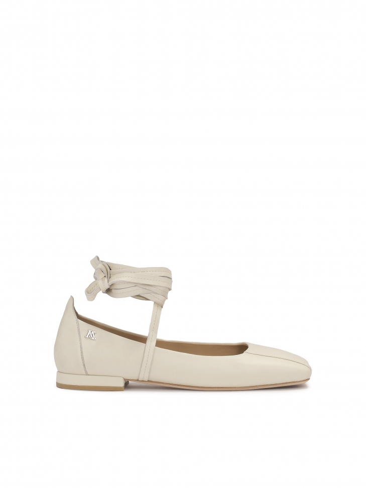 Beige pumps with binding around the ankle