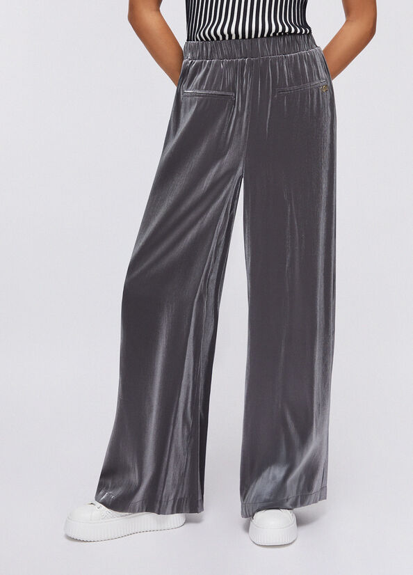 Pantaloni flare laminati