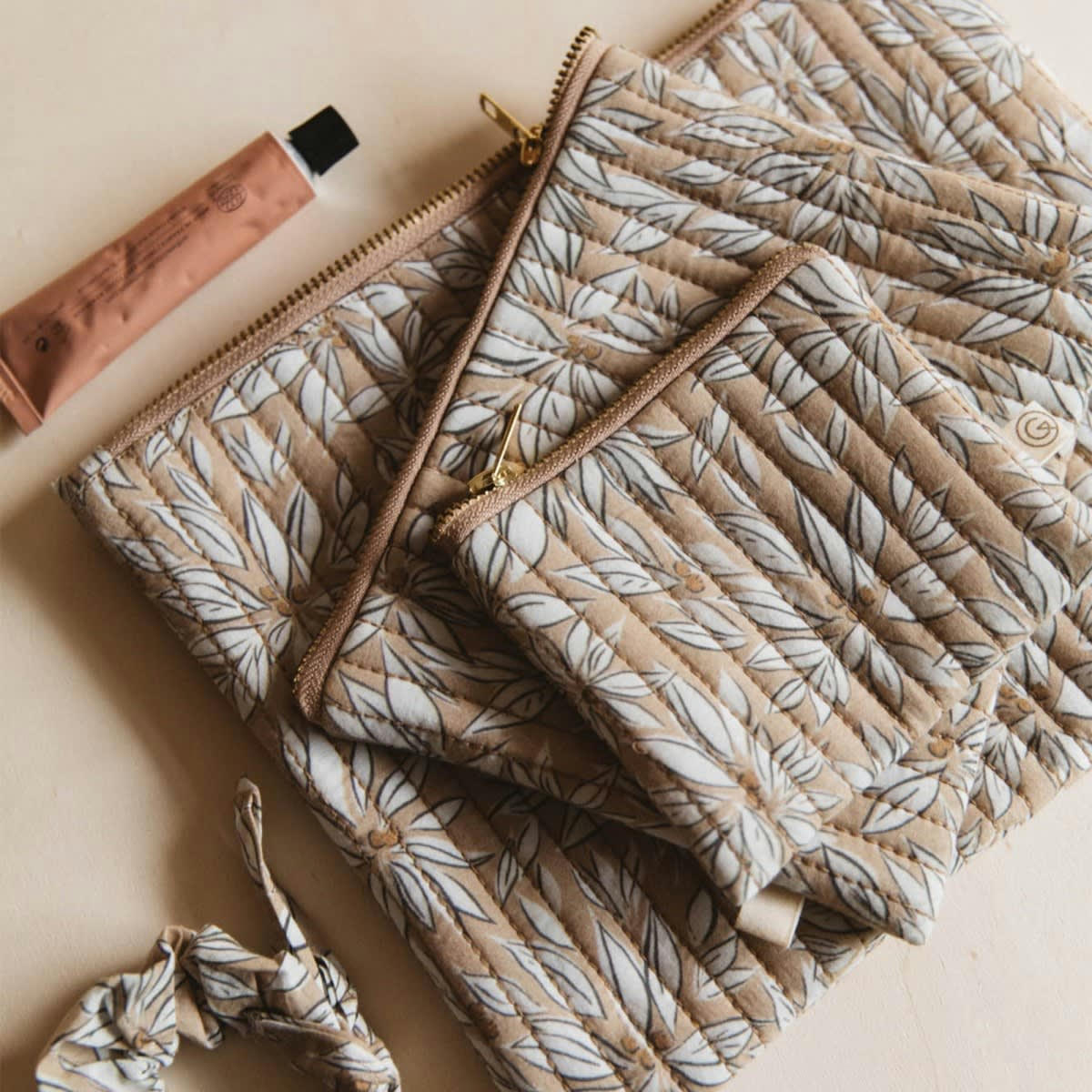 LA CABANE - Porte-monnaie en coton imprimé feuille beige