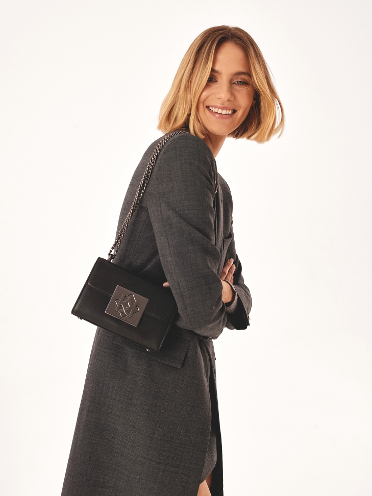 Small rigid bag with large clasp