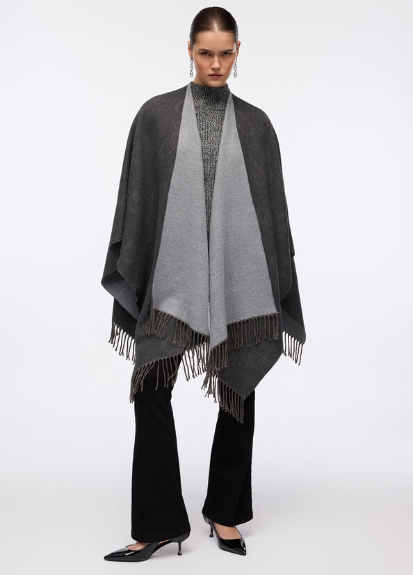 Poncho con logo e frange