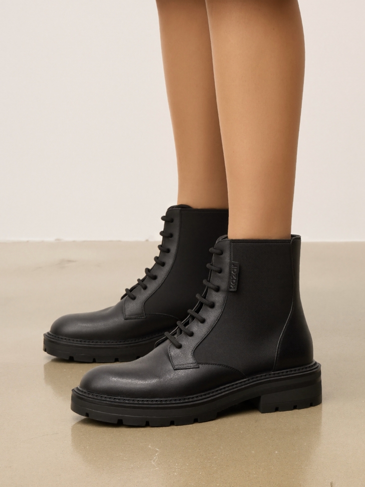 Lace-up boots with elastic insert