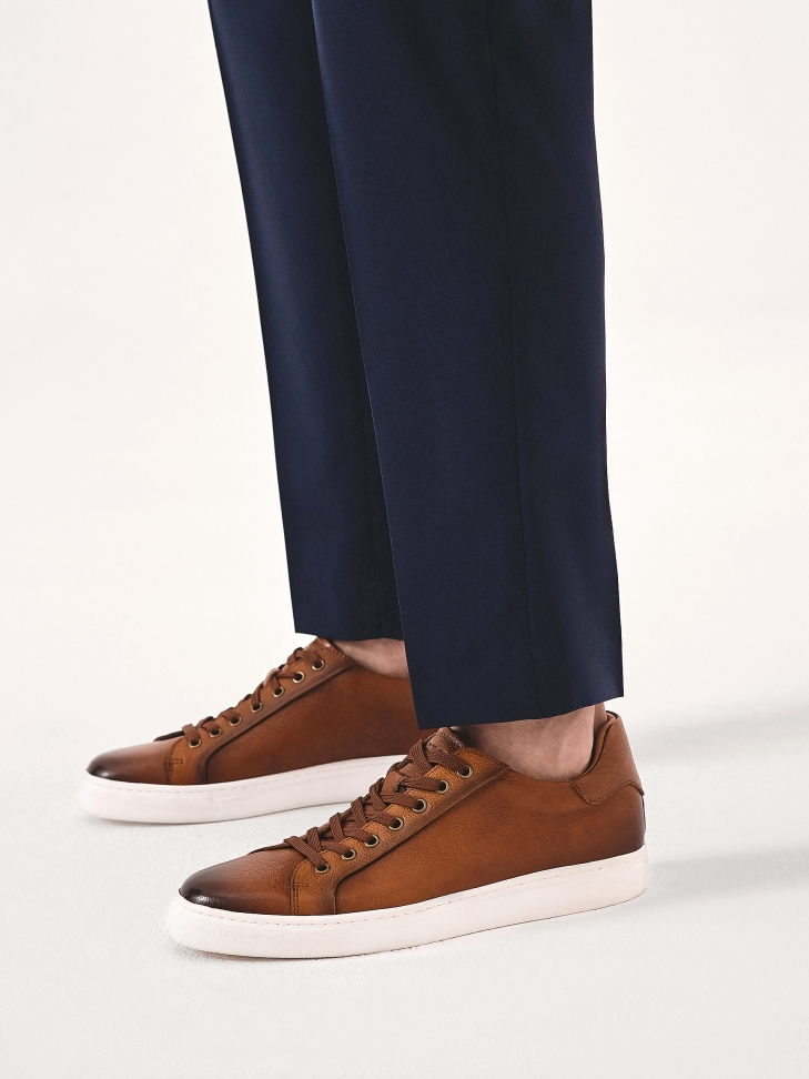 Minimalist brown sneakers with white sole