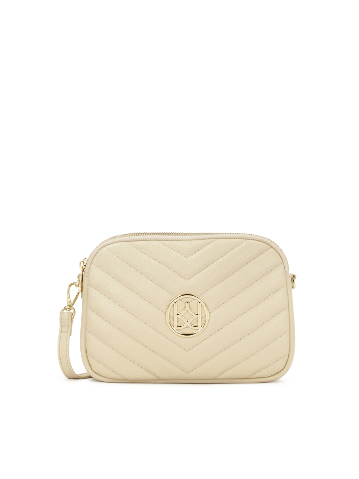 Cream crossbody bag with large KAZAR monogram.