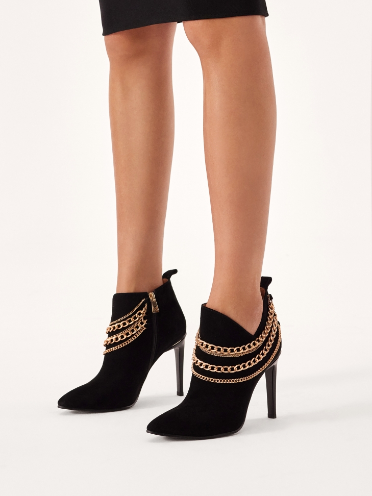 Striking stiletto boots with cut-out upper