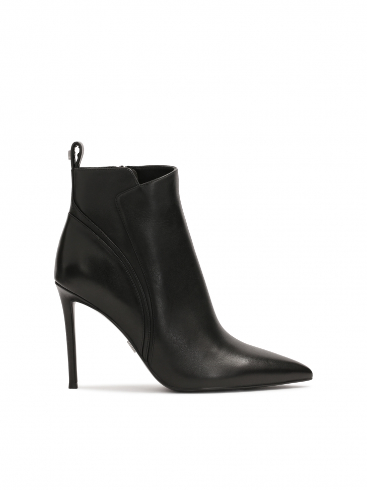 Black boots with wavy stitching on the upper