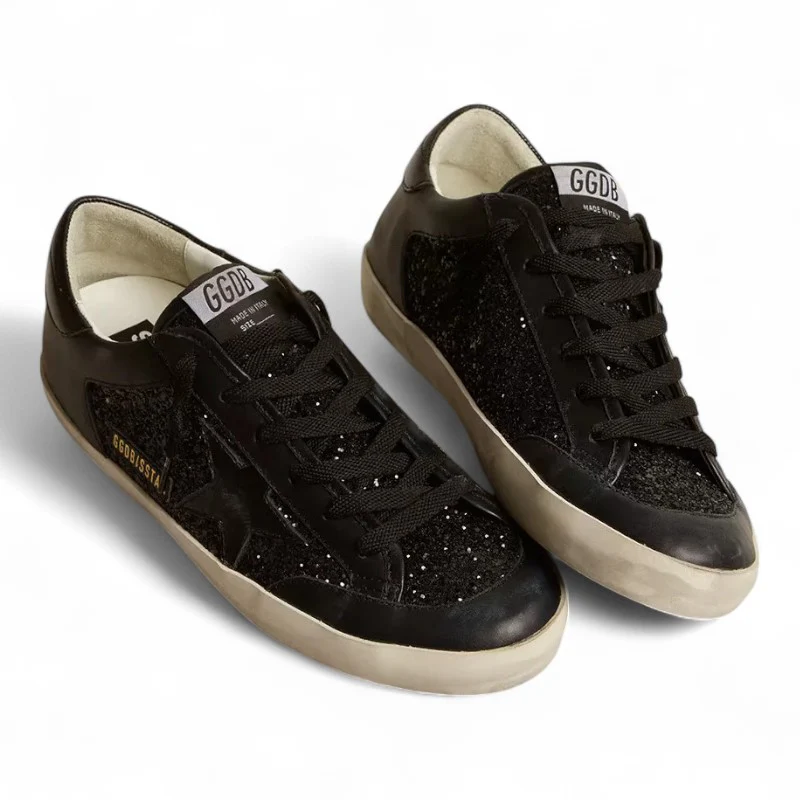 Super-Star in black nappa and glitter with glossy black leather star