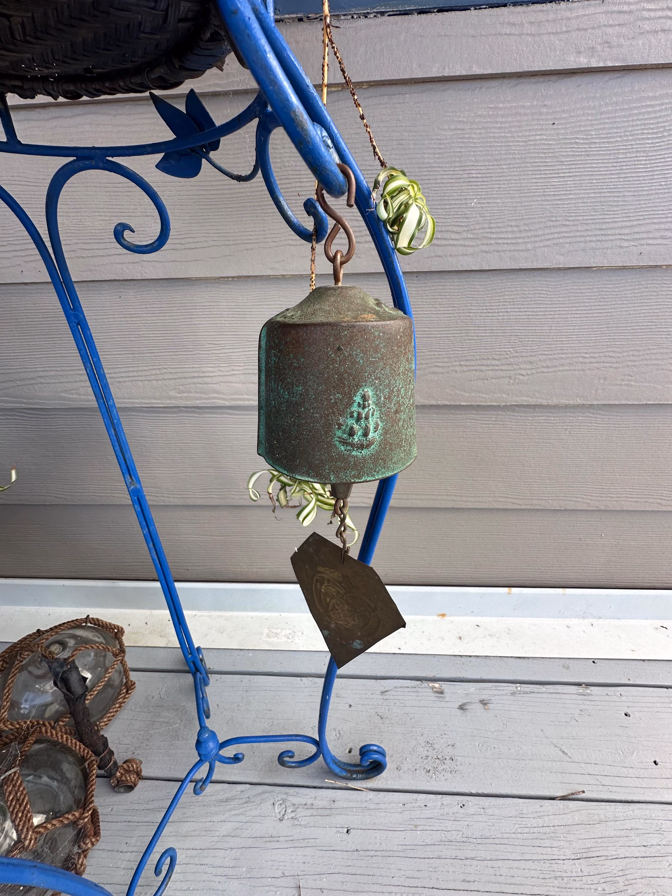 A vintage Harmony Hollow Bell Works (HHBW) patinated bronze bell Wind Chime