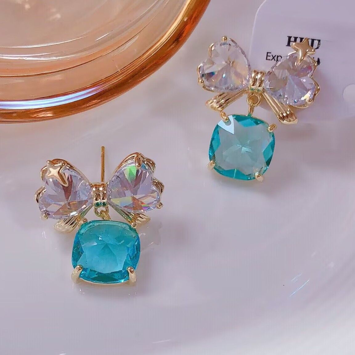PEACH ACCESSORIES Blue Sparkling Crystal Bow Drop Earrings