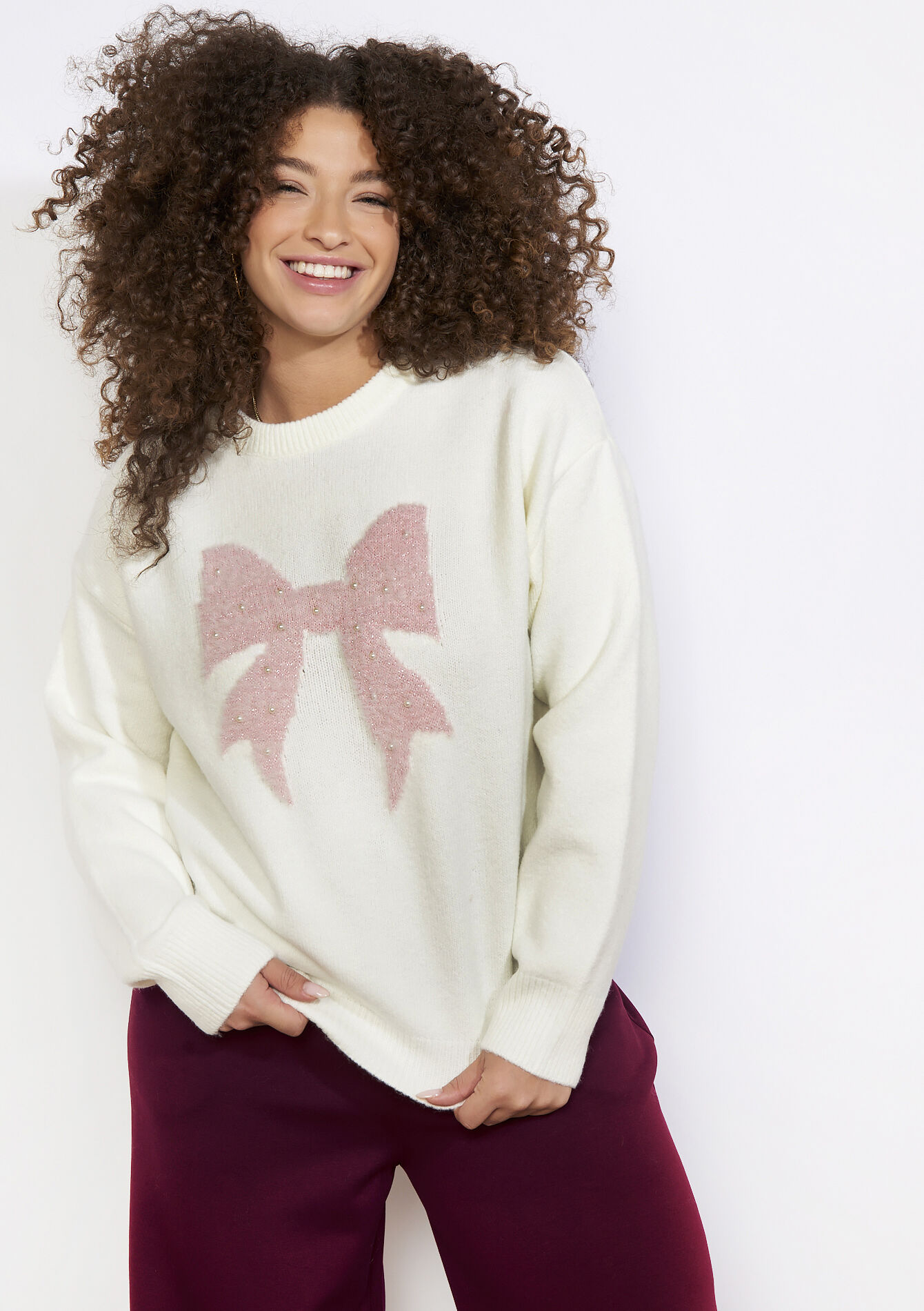 Trui met paillettenstrik