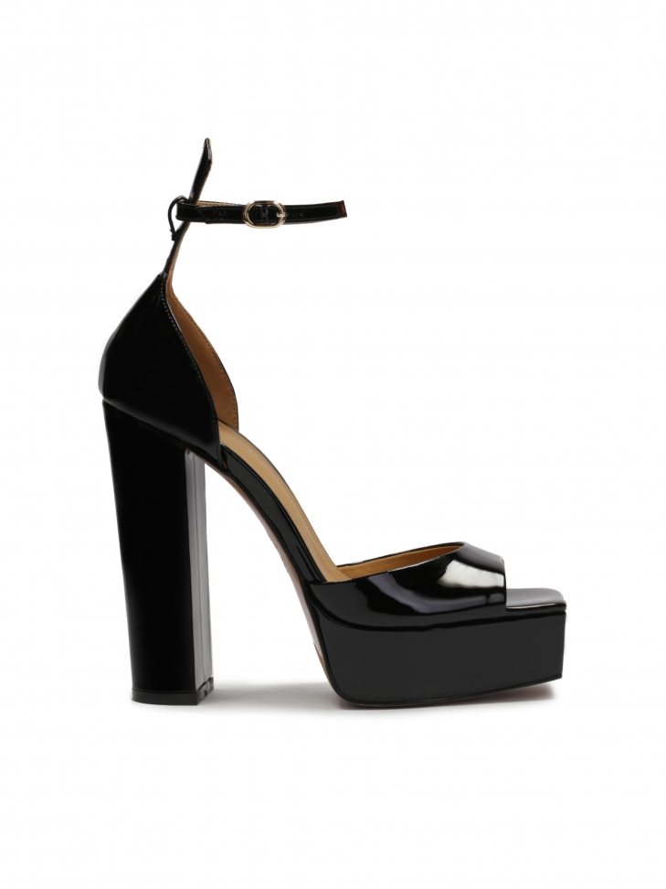 Patent leather sandals on a high heel and a platform