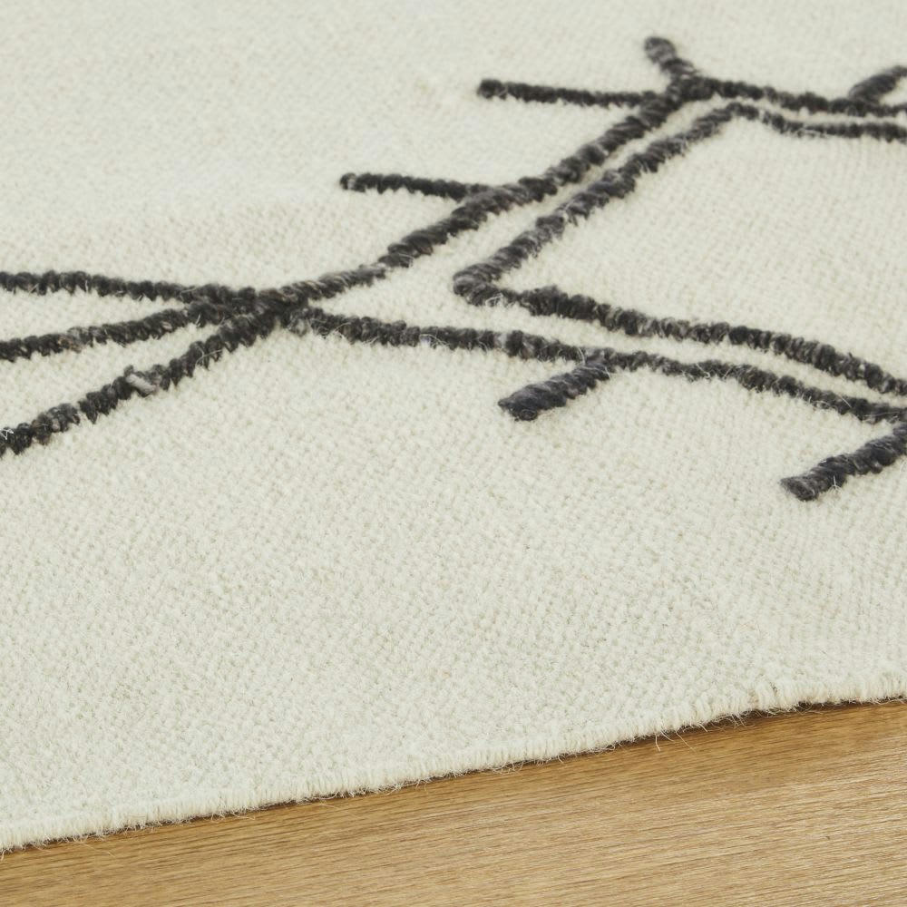 AMENZU - Tapis style berbère en laine, coton et bambou noir et blanc 140x200