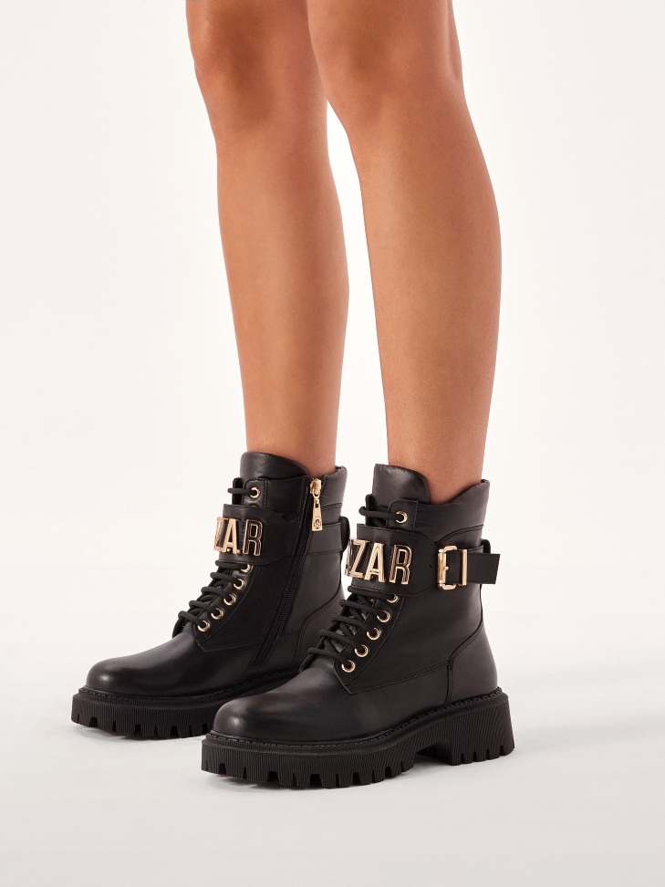 Women's leather boots decorated with metal lettering