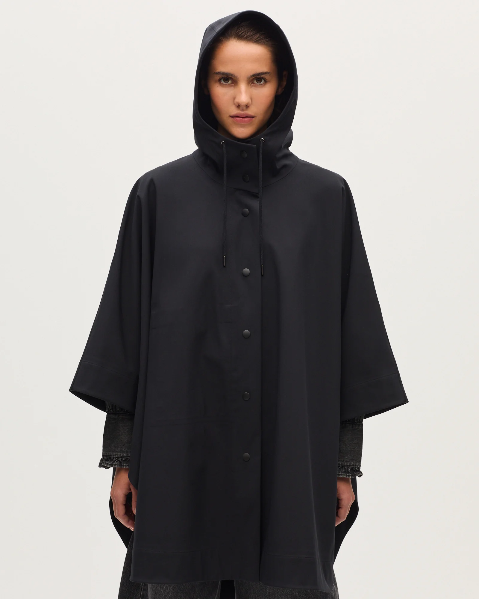 Cape imperméable à capuche