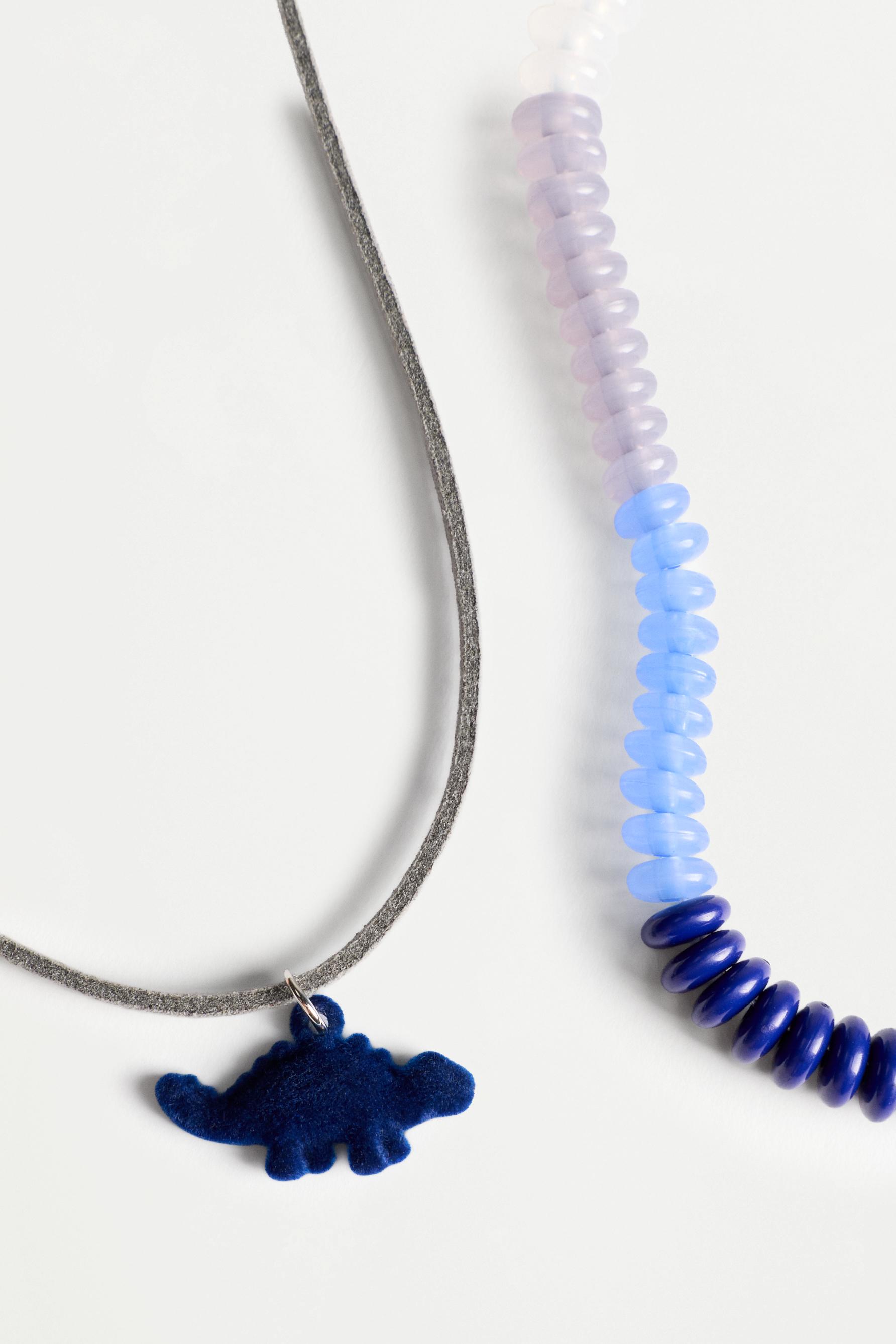 Collar doble dinosaurio