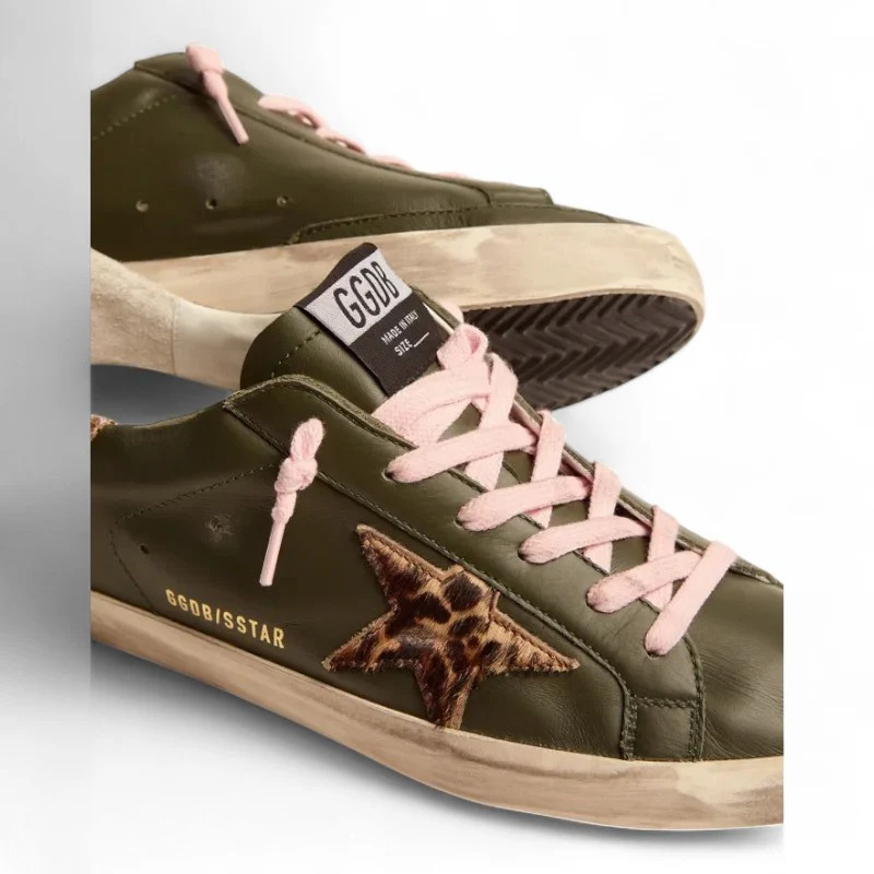 The Super-Star sneakers in dark green leather with a gold glitter heel tab