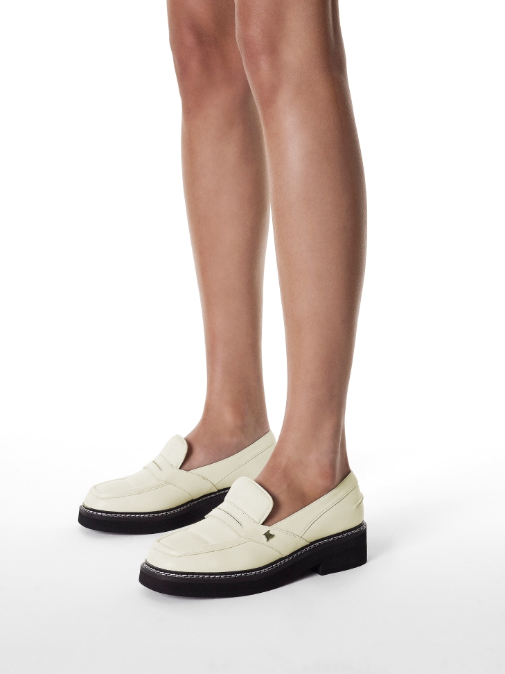 Off-white leather loafers with black sole