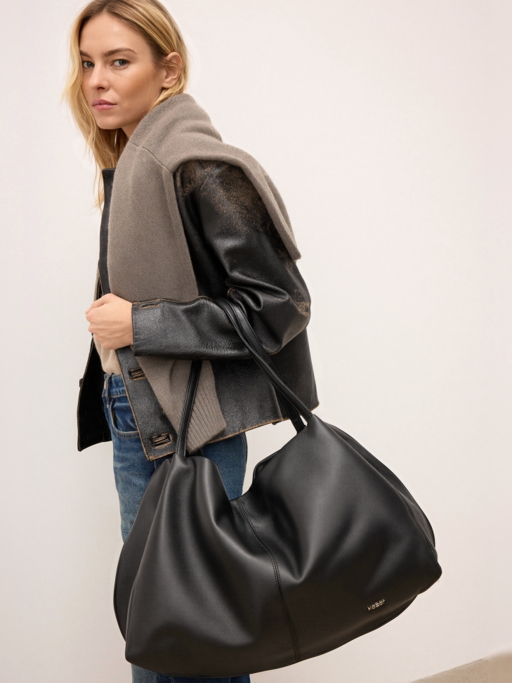 Black natural leather handbag with a loose fit