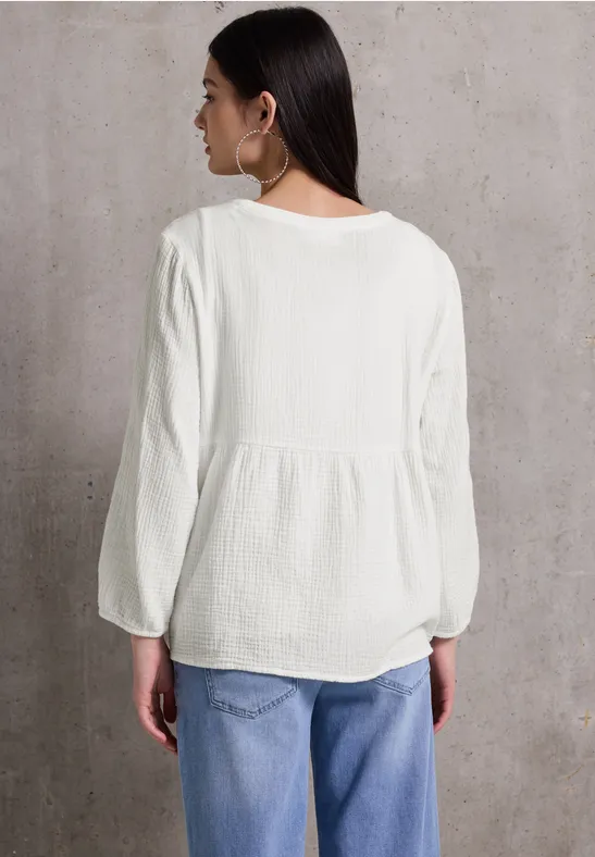 Musselintunika mit Stickerei