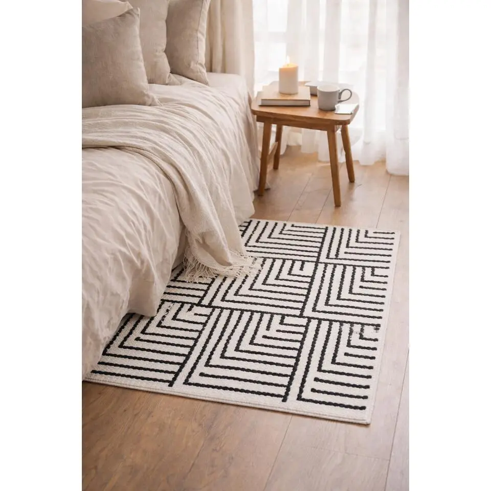 Rechthoekig katoenen tapijt met beige en zwarte motieven 90 x 60 cm