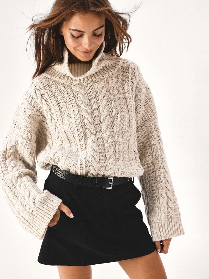 Black leather belt decorated with silver eyelets